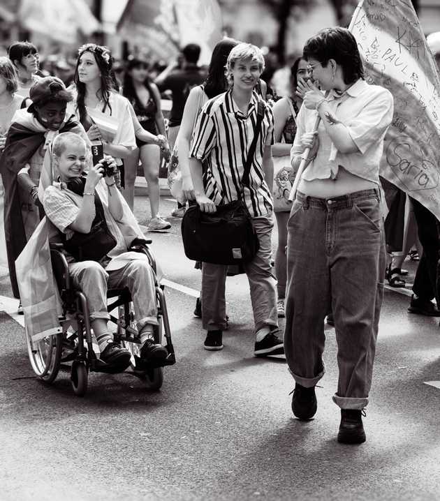 Pride parade participants marching through Vienna